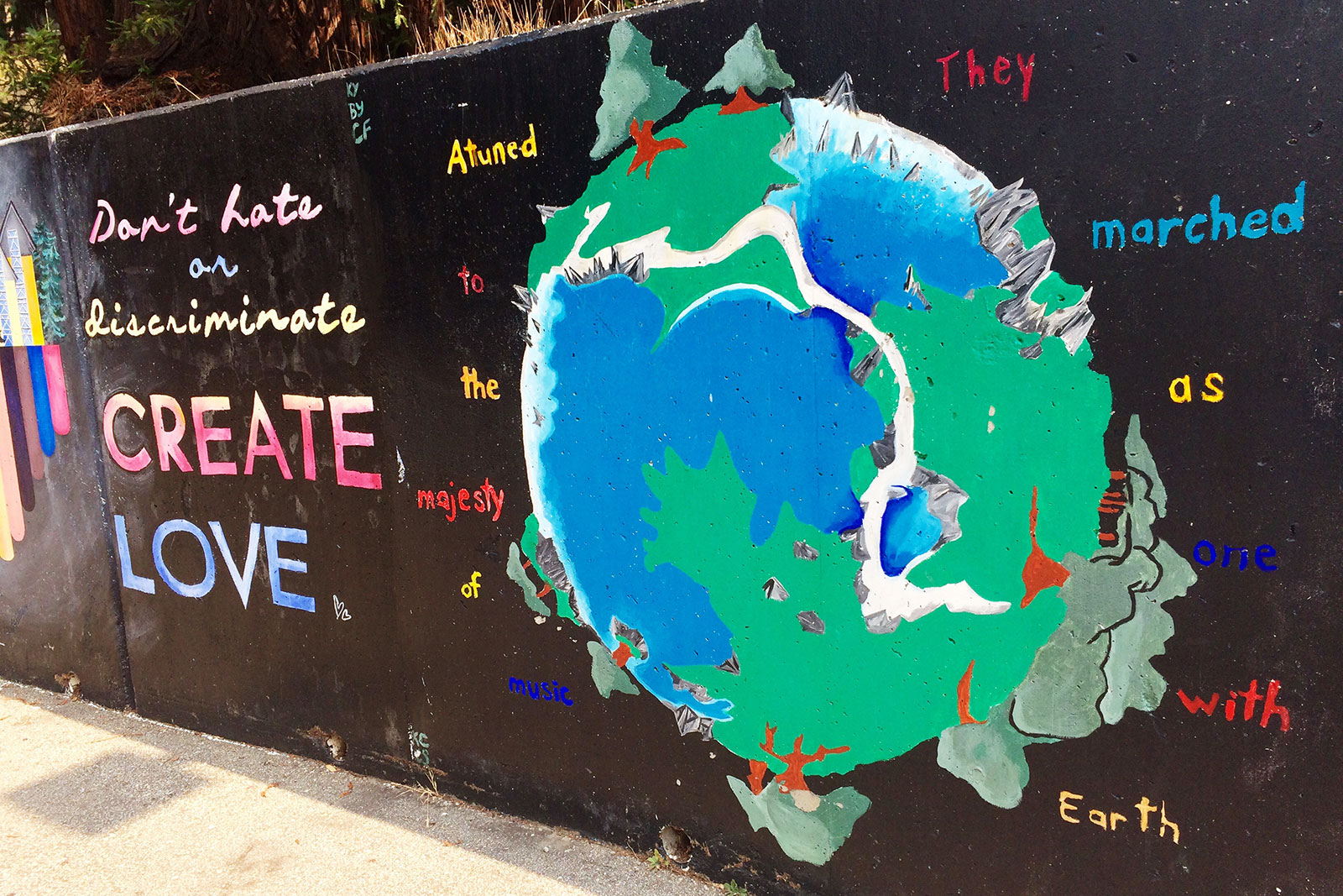 Mural with planet earth and different love messages