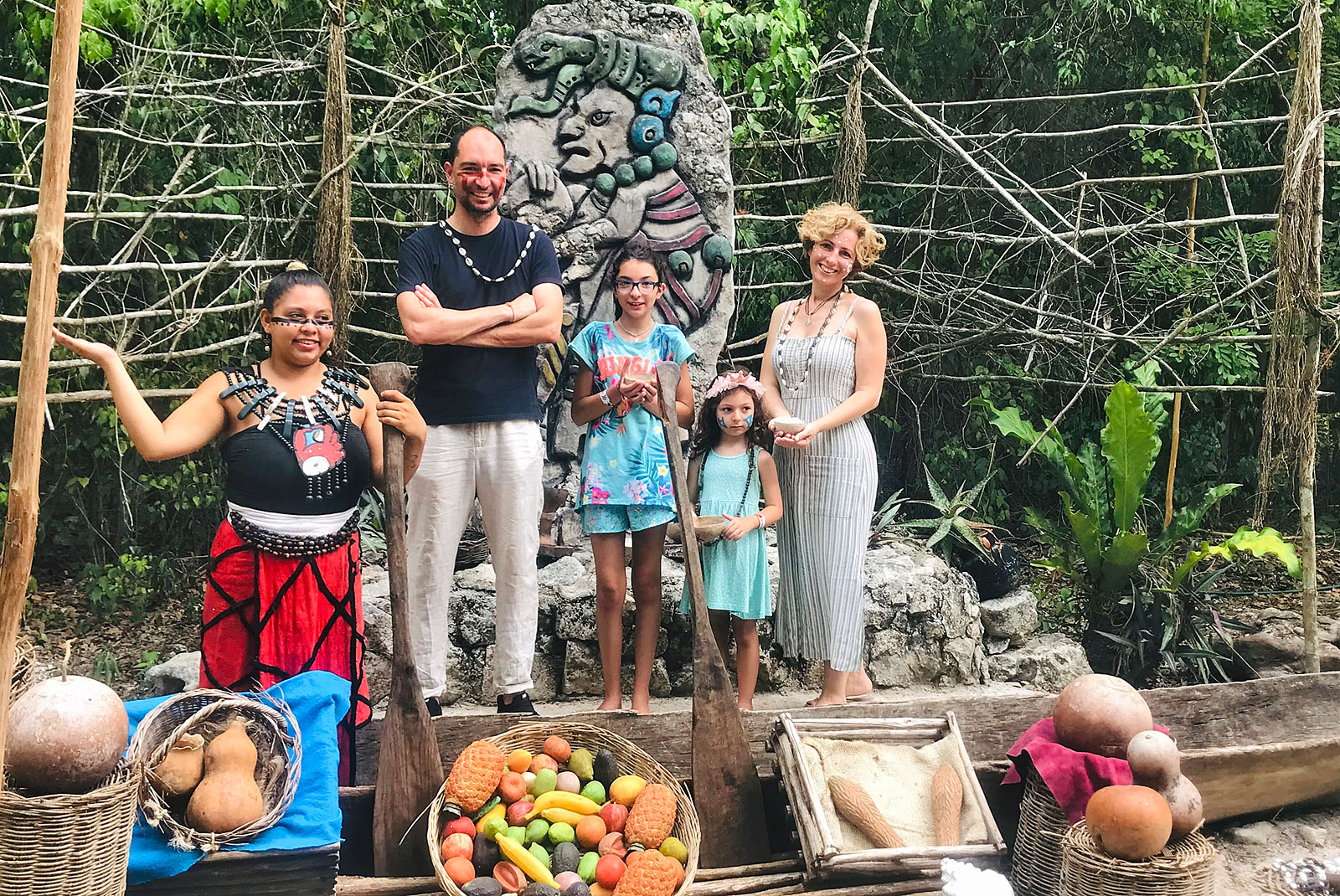 Rita Alelua and family with street fruit seller in Indonesia