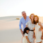 A generative family: Rita Alelua with Ernesto and children on a beach, at sunset